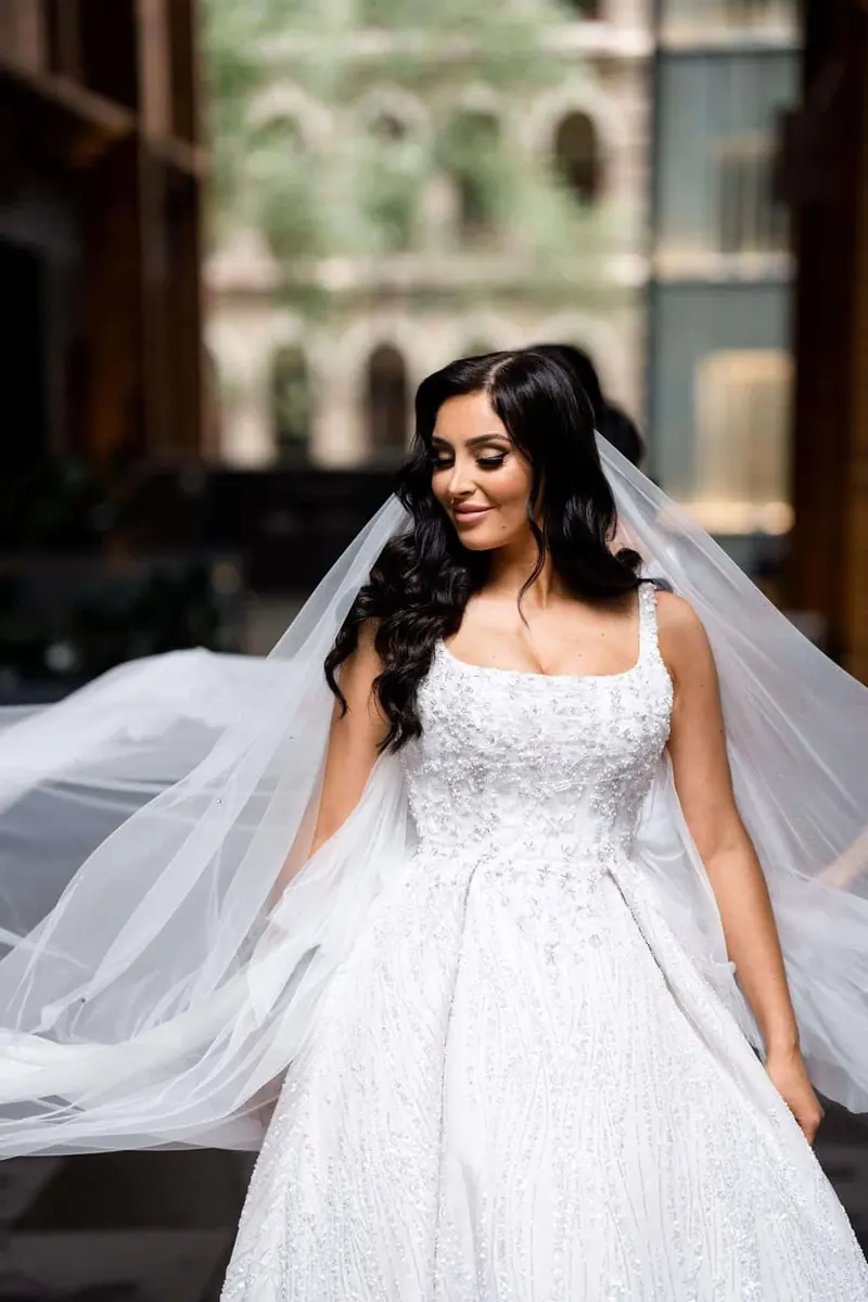 Lauren, A classic ball gown with a square neckline and beaded lace